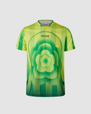 Sundae School Sour Yuzu lime green and yellow soccer jersey featuring central floral logo design with halftone dot pattern, "SUNDAE" chest branding, yellow and green vertical stripe details on shoulders, green collar with contrast trim, athletic fit silhouette, flat lay product shot on light background.