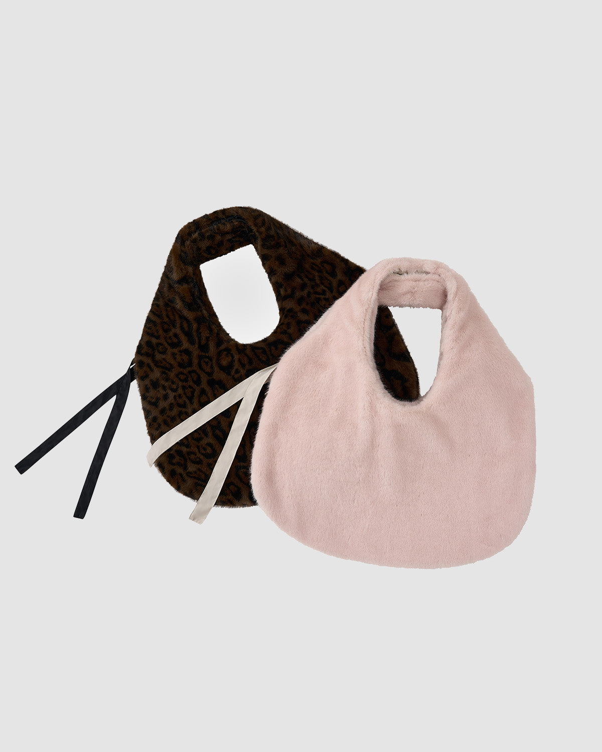 The Sundae School BLACK LEOPARD BAEJA VEST / BAG features two soft faux fur bags: a light pink version and a brown leopard print, each with a handle and contrasting ribbon tie, offering both cozy comfort and stylish flair.