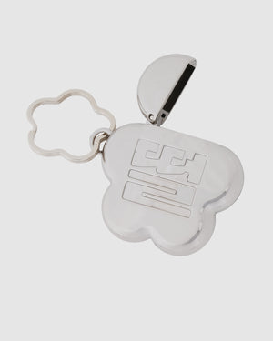 Sundae School Silver Mochi Lighter Case shown open revealing black lighter inside mochi flower-shaped case, attached to silver flower-shaped keychain with metal ring, flat shot on light gray background.