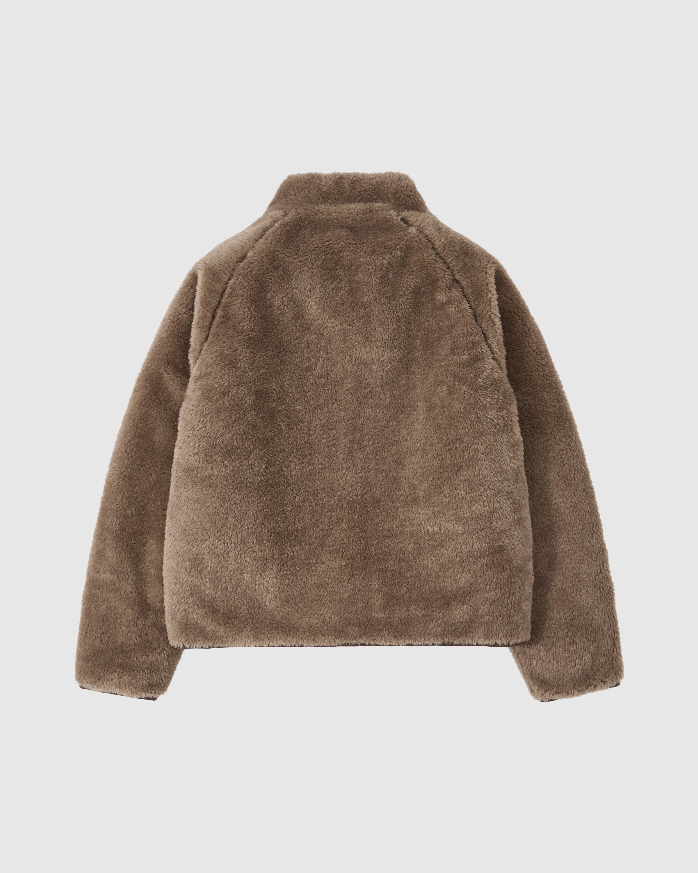 Back view of the brown teddy fleece side of the Reversible Flower Quilted Jeogori Fleece with textured sherpa material.