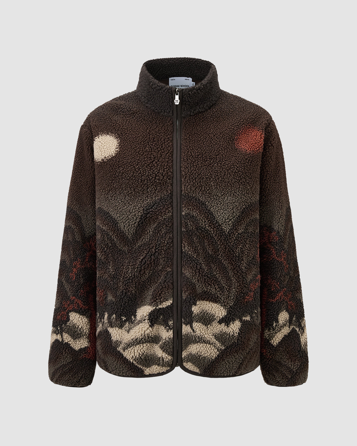 The Sundae School CHARCOAL FIVE PEAKS FLEECE is a fuzzy zip-up jacket with embossed pile fleece, featuring mountains, cream clouds, and red and white sun or moon motifs on the front against a light gray background.