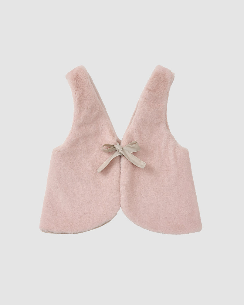 The SILVER PINK BAEJA VEST / BAG by Sundae School is a soft, sleeveless light pink faux fur vest with a rounded hem and beige ribbon bow at the back, displayed flat on a white background.