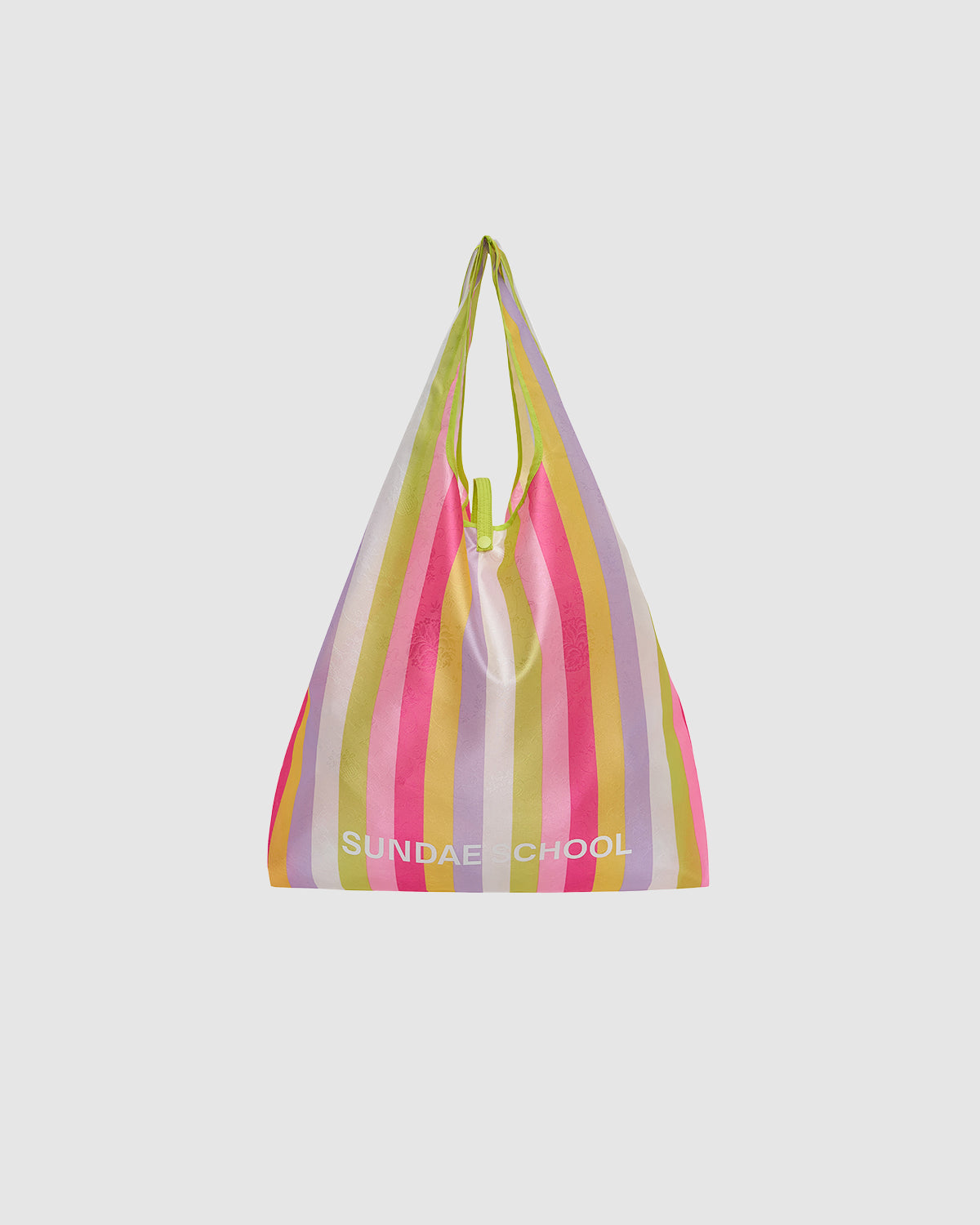 The BIG BOJAGI TOTE BAG by Sundae School is a reusable, oversized bag with pink, yellow, green, and lavender vertical stripes, a slouchy shape, top handle, and 