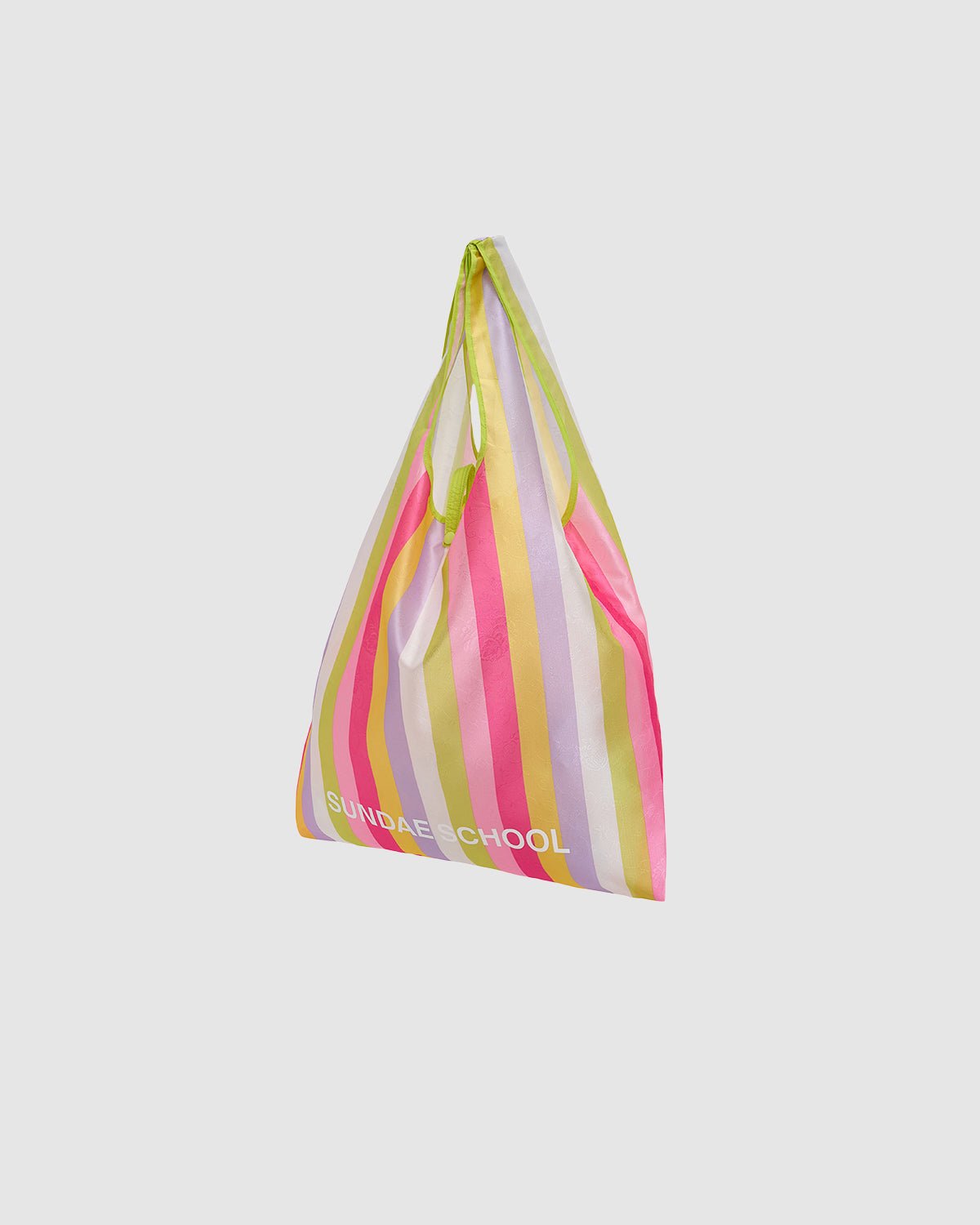 The BIG BOJAGI TOTE BAG by Sundae School is an oversized, triangular tote with pink, yellow, white, and green vertical stripes, “SUNDAE SCHOOL” printed near the bottom, and a reusable sling-style design for a unique look.