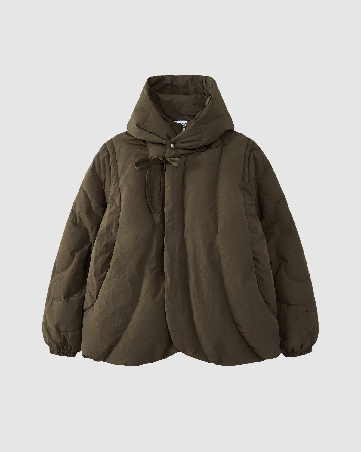 The Sundae School [PRE-ORDER] KHAKI HEAVYWEIGHT MOCHI PUFFER is a hanbok-inspired, olive green puffer jacket with mochi quilting, hood, front tie closure, and curved hem, shown on a plain light gray background.