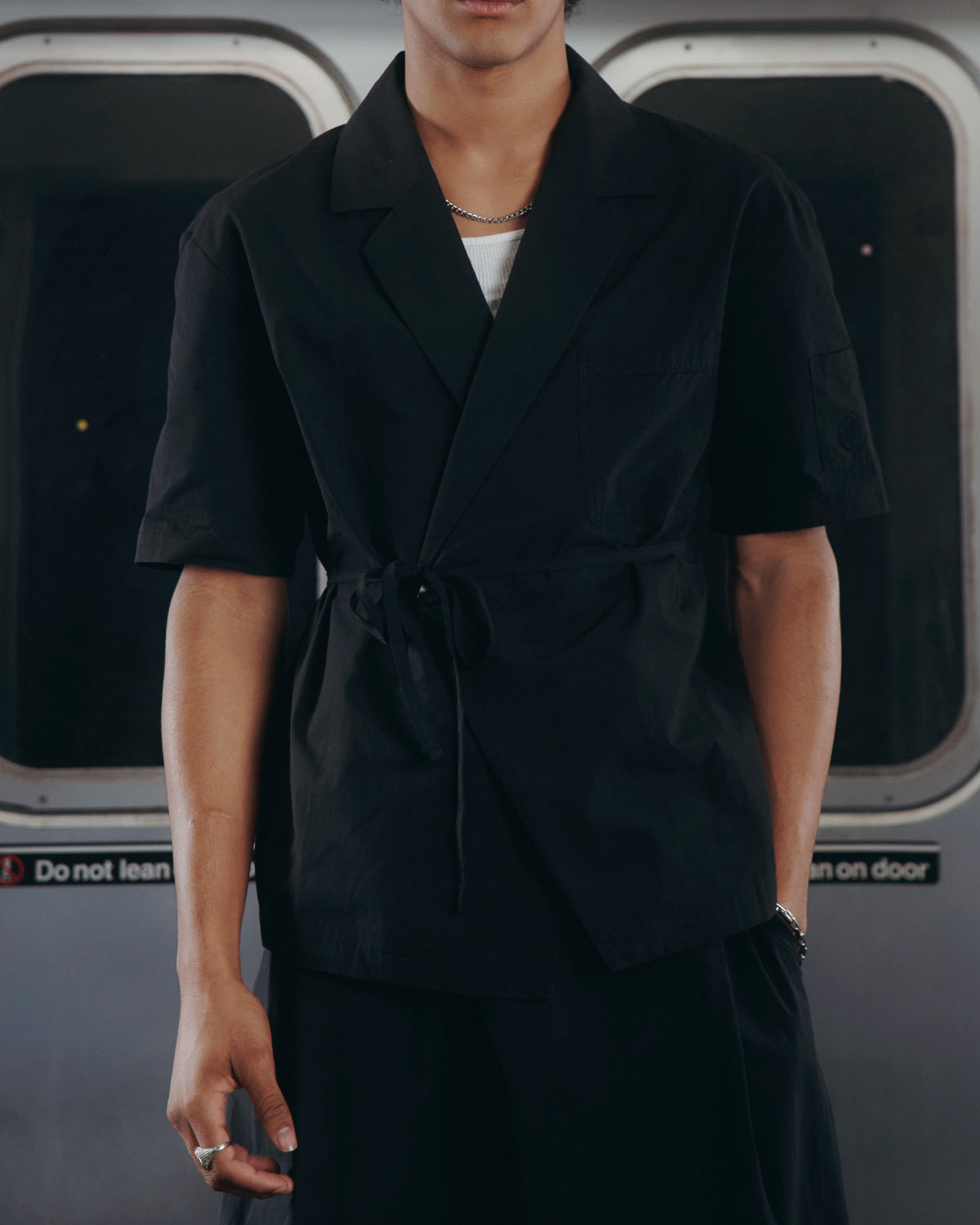 A model wearing SUNDAE SCHOOL BLACK HANBOK LINEN SHIRT