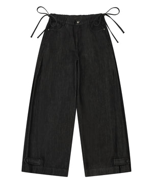 Sundae School BLACK ACCORDION DENIM PANTS: black wide-leg flare pants with inverted pleats, side ties at the waistband, and adjustable tabs at the cuffs.