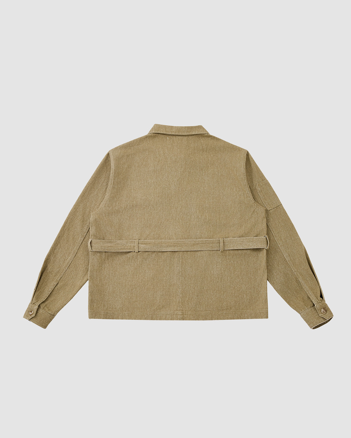 The Sundae School TAN ASYMMETRIC WORK JACKET is a khaki unisex piece with long sleeves, a belt at the waist, buttoned cuffs, straight hem, collar, and seven functional pockets for versatile storage.