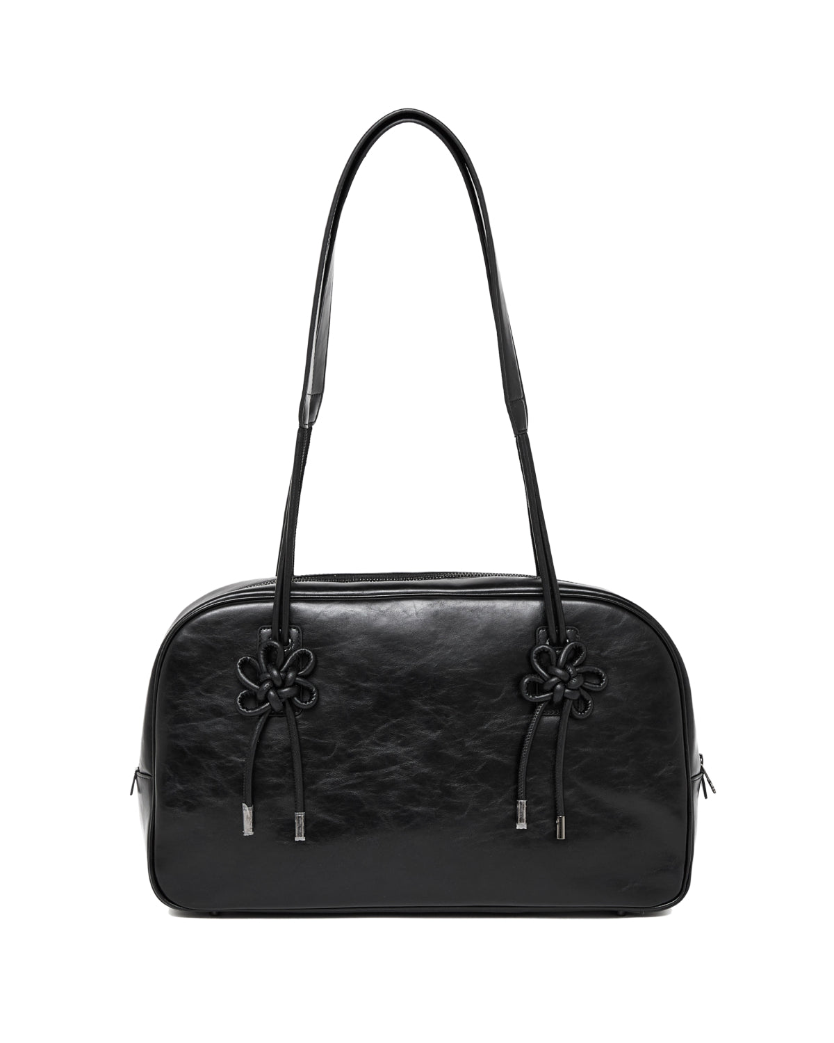 The BLACK AUDREY BOWLING BAG by Sundae School is a black leather handbag featuring two decorative knots on the front and two long shoulder straps, displayed against a plain white background.