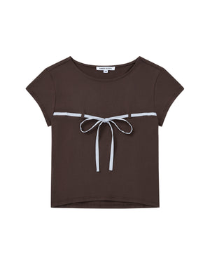The BROWN TIE GORUM BABY TEE by Sundae School is a short-sleeved, dark brown cropped baby tee featuring a scooped neckline and a light blue bow strap tied across the chest.