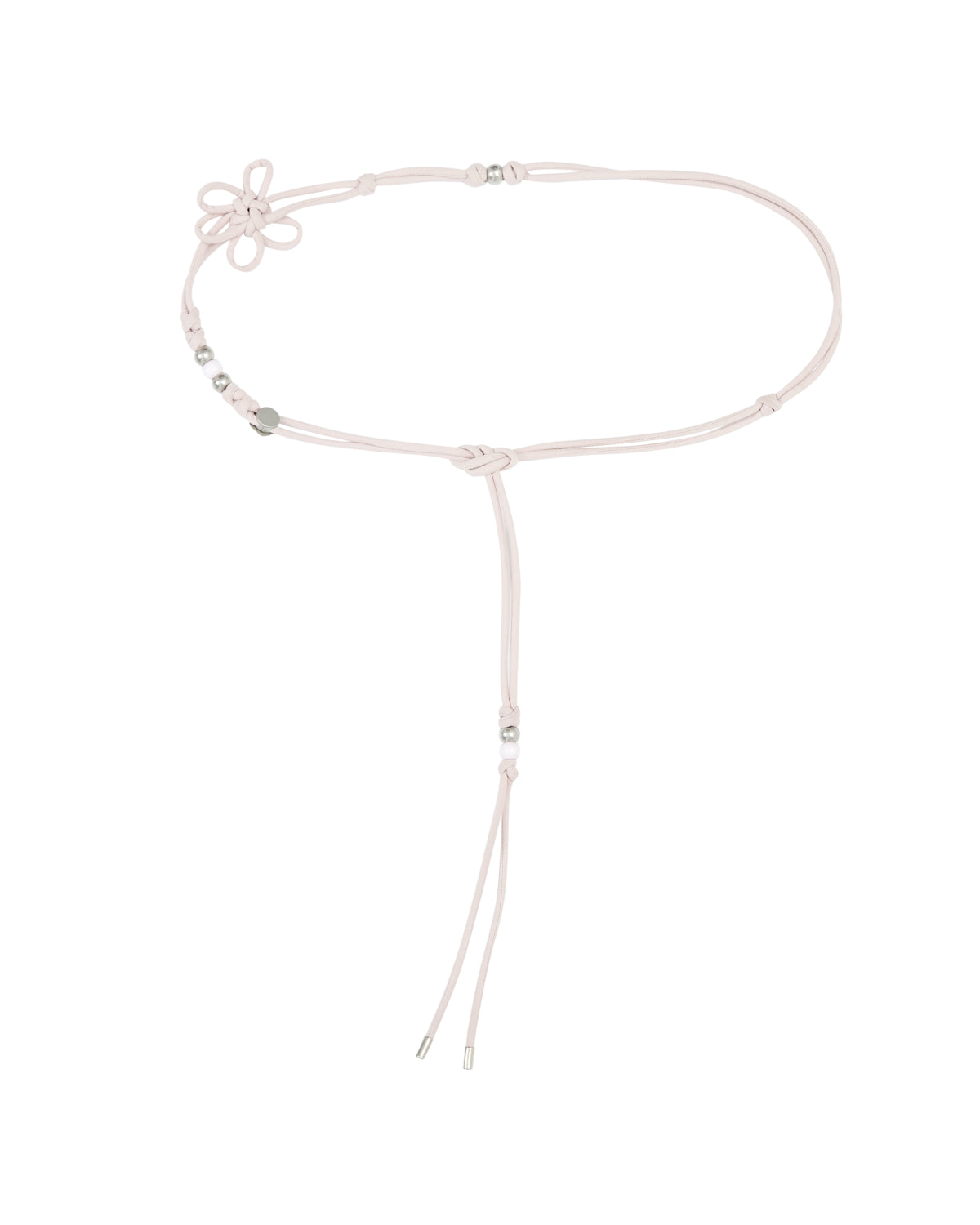 The BABY PINK MAEHWA MACRAME BELT by Sundae School features a light pink adjustable cord with silver beads and a flower-shaped knot detail on one side, finished with two loose ends that hang down—a heritage-textured accessory that beautifully blends traditional style and modern elegance.