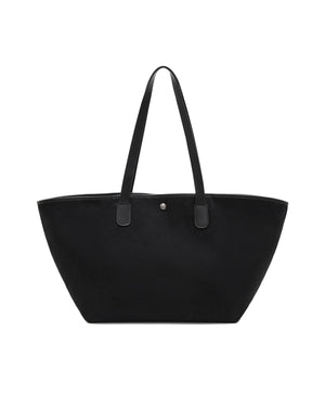 A black Sundae School BLACK BOJAGI TIE TOTE BAG with vegan leather handles, two shoulder straps, and a central snap closure.