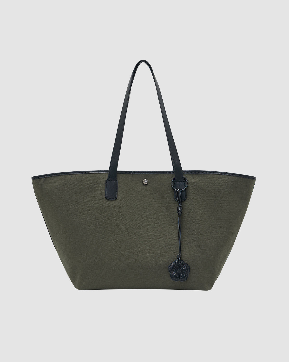 The OLIVE BOJAGI TIE TOTE BAG by Sundae School is a large olive green tote with black vegan leather trim, handles, and a black keychain charm on one handle, shown against a plain light background.