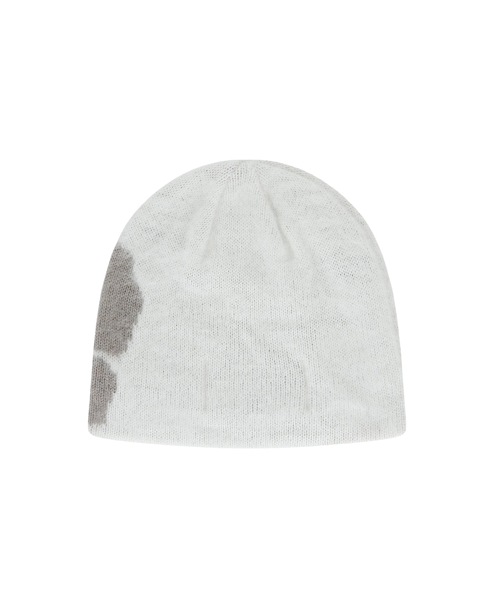 The Ivory Ddul Beanie by Sundae School is a white acrylic beanie featuring a large light gray patch on one side, shown against a plain light gray background—combining cozy style with a hint of playful protection.