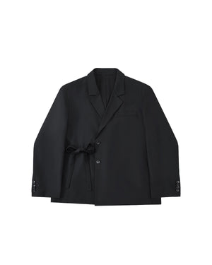 The BLACK DOUBLE DUTY BLAZER by Sundae School features a notched lapel, button closure, and hidden left-side goreum tie waist, shown laid flat on a light gray background.