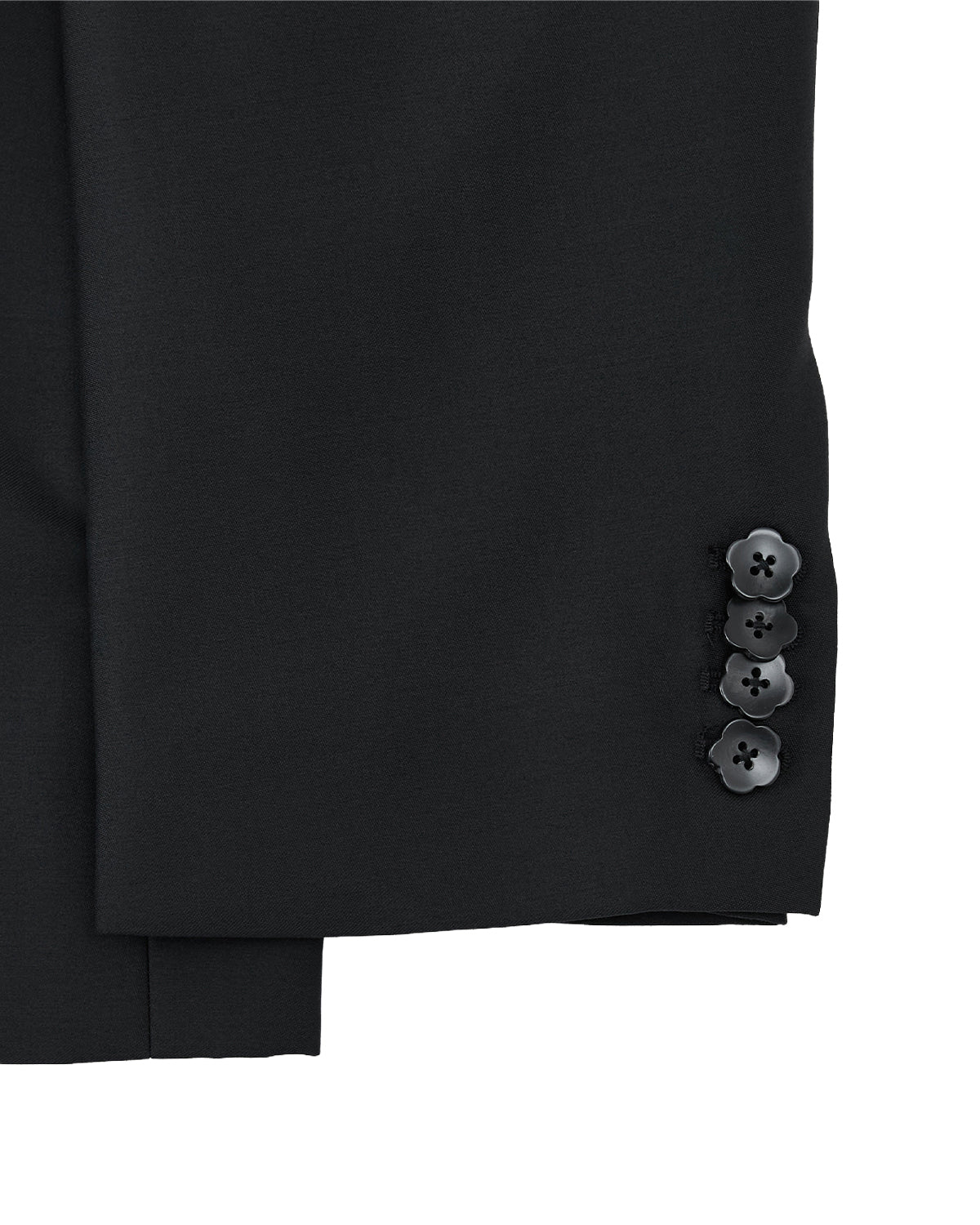 Close-up of the BLACK DOUBLE DUTY BLAZER by Sundae School: unisex black wool sleeve with four cuff buttons, set against a light gray background.