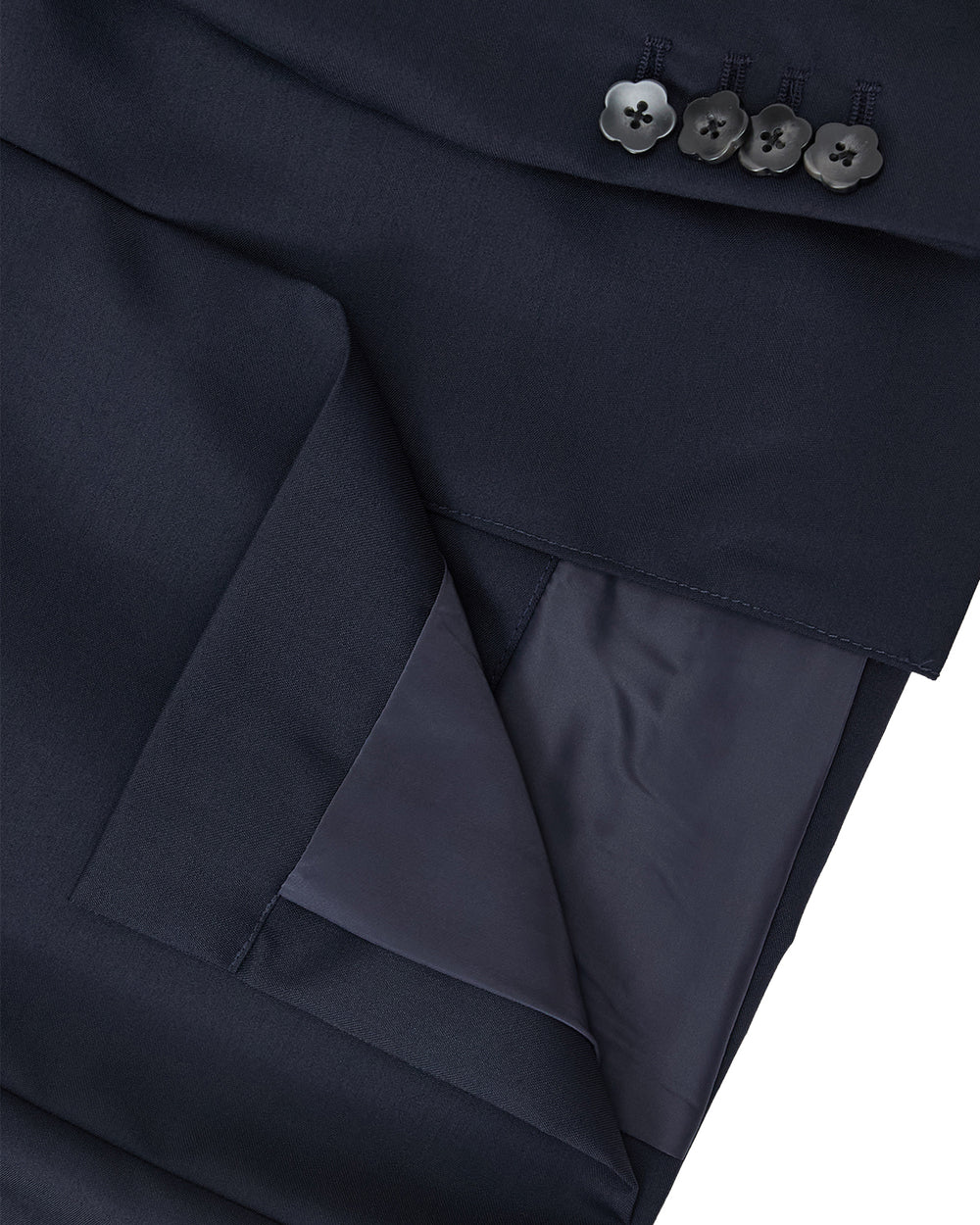 Close-up of the Sundae School NAVY DOUBLE DUTY BLAZER cuff, featuring four black buttons and a smooth, slightly shiny inner lining.