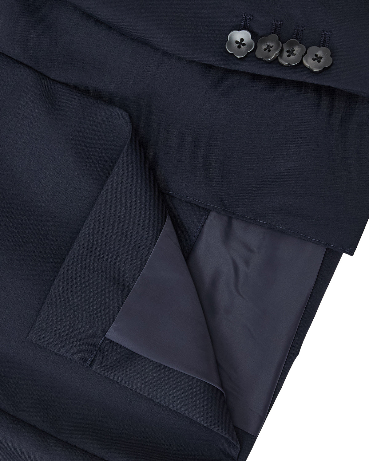 Close-up of the Sundae School NAVY DOUBLE DUTY BLAZER cuff, featuring four black buttons and a smooth, slightly shiny inner lining.