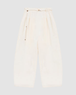 The IVORY FLOWER NORIGAE LINEN TROUSERS by Sundae School, featuring a wide-leg, high-waisted silhouette in cream cotton-linen with front pleats and an attached detachable norigae belt, are laid flat on a light gray background.