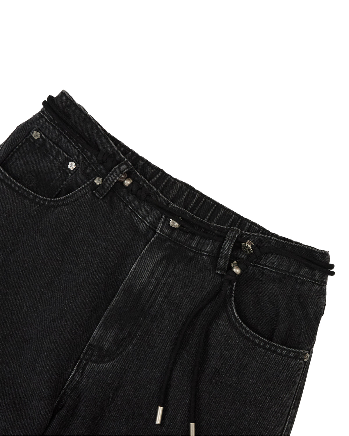 Close-up of the waistband of Sundae School’s BLACK WIDOW FRESHMAN FIT DENIM jeans, featuring an elastic band with a black drawstring, silver grommets, and classic front pockets, shown against a white background.