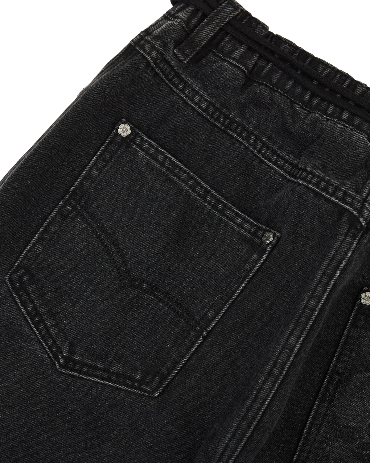 Close-up of the back pocket and waistband of a pair of Sundae School BLACK WIDOW FRESHMAN FIT DENIM jeans, featuring visible stitching and metal rivets.