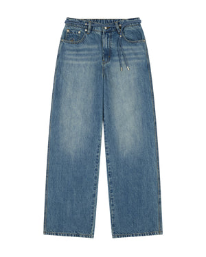 MEDIUM BLUE FRESHMAN FIT DENIM by Sundae School, featuring a wide-leg silhouette in a medium blue faded wash, five pockets, and a drawstring norigae belt waistband, laid flat on a white background.