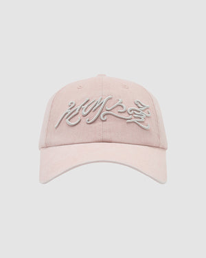 The BABY PINK FLOWER KNOT CAP by Sundae School is light pink with white embroidered script on the front, shown against a plain light gray background.