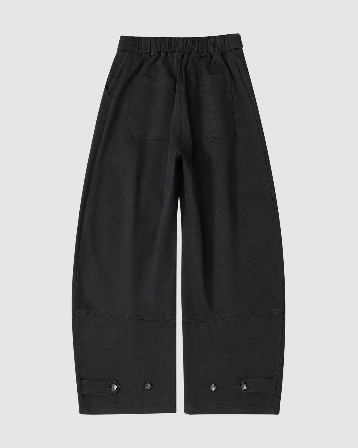 BLACK HANBOK CHINO PANTS by Sundae School—a unisex, hanbok-inspired silhouette with wide legs, elastic waistband, large front pockets, and buttoned cuffs—shown laid flat on a light gray background.