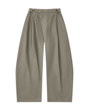 STONE KIEF HANBOK CHINO PANTS in taupe, featuring a barrel-fit, high waist, buttoned side tabs, and a wrap-style front panel.