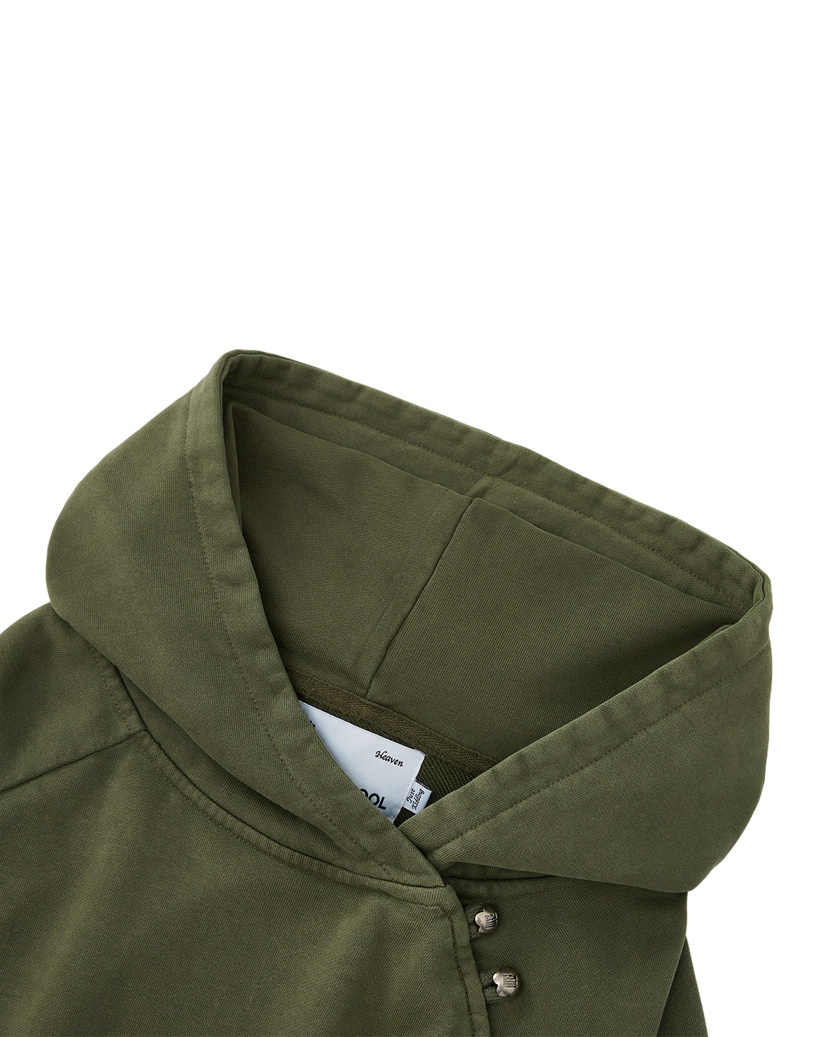 Close-up of the Sundae School KHAKI HANBOK HOODIE, a custom olive green hoodie featuring an asymmetric hood closure with metal snap buttons near the neckline and a white label partially visible inside the hood. The soft, slightly structured fabric complements its modern design, while the signature sleeve stash pocket provides a subtle yet functional detail.