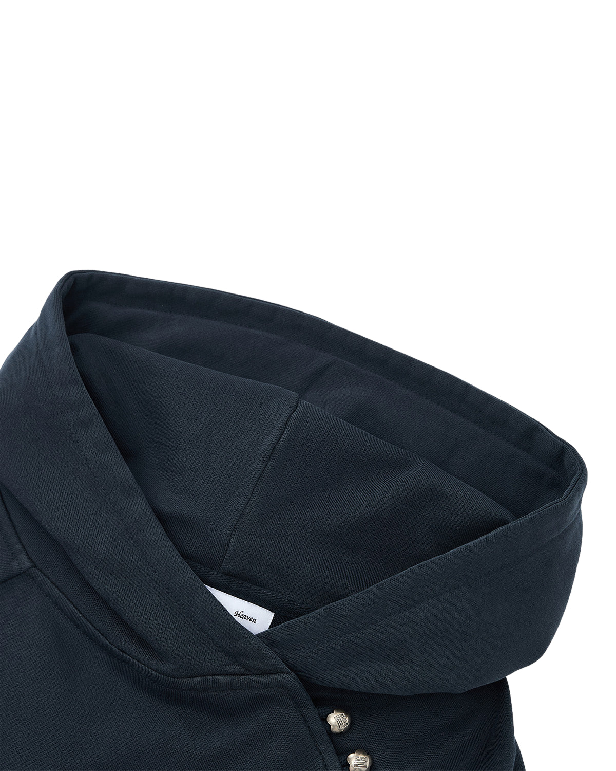 Close-up of the hood and collar area of the INDIGO WASH HANBOK HOODIE by Sundae School, featuring a partial label and silver snap buttons on the side.
