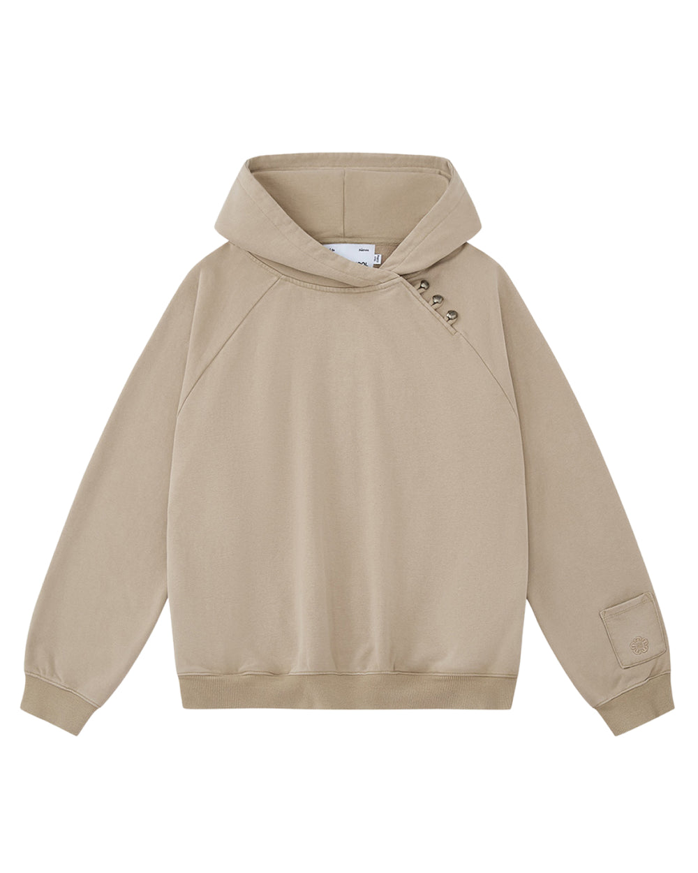 The TAUPE HANBOK HOODIE by Sundae School is a beige hooded sweatshirt featuring an asymmetric hood closure with three snap buttons near the collar, long sleeves, ribbed cuffs and hem, and a signature stash pocket embroidered with a custom “떨” logo on the left sleeve. The hoodie is laid flat on a white background.