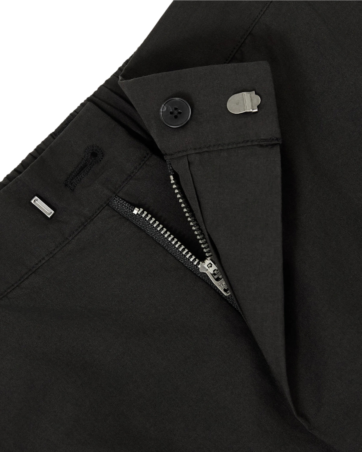 Close-up of BLACK HANBOK LINEN PANTS by Sundae School, featuring a partially open zipper that reveals the button, hook-and-bar closure, and detailed waistband. The adjustable waist design enhances comfort and fit, while the wide barrel leg creates a modern silhouette on these cotton linen balloon pants.