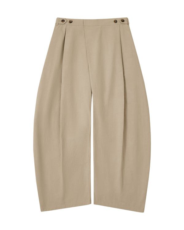 Introducing the WHEAT HANBOK LINEN PANTS by Sundae School—crafted from a comfortable cotton-linen blend, these beige pants feature front pleats, distinctive side button details at the waistband, and an adjustable waist for everyday comfort. Designed with a relaxed, loose fit and a modern wide barrel leg silhouette, they bring effortless versatility to your wardrobe.