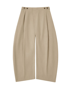 Introducing the WHEAT HANBOK LINEN PANTS by Sundae School—crafted from a comfortable cotton-linen blend, these beige pants feature front pleats, distinctive side button details at the waistband, and an adjustable waist for everyday comfort. Designed with a relaxed, loose fit and a modern wide barrel leg silhouette, they bring effortless versatility to your wardrobe.