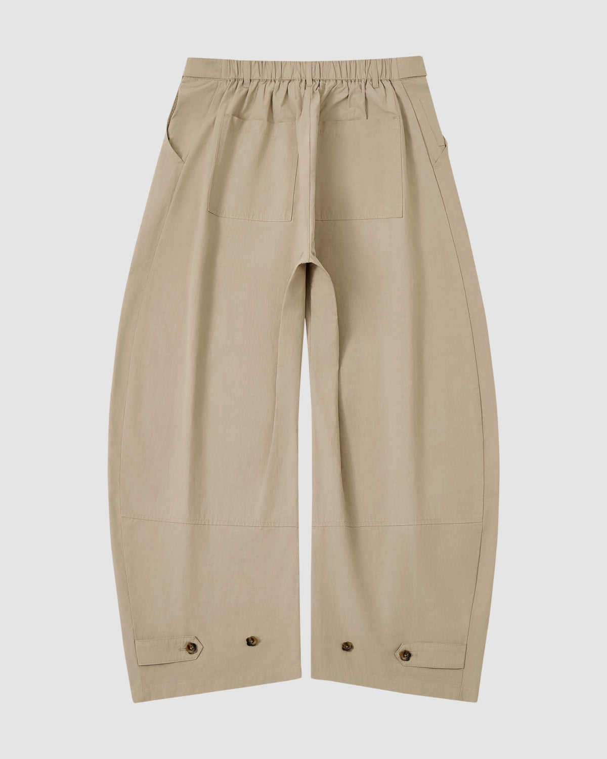 Sundae School’s WHEAT HANBOK LINEN PANTS in beige cotton-linen feature an adjustable waist, front patch pockets, and button details near the hem, shown against a plain white background.