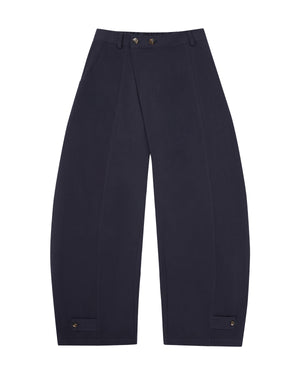 The NAVY HANBOK BALLOON PANTS by Sundae School, inspired by K-drama style, showcase a stylish balloon silhouette with wide legs, an elastic waistband, spacious front pockets, and button accents at the ankles. Crafted from breathable cotton in a navy blue shade, these pants are laid flat on a white background—perfect for elevating any casual look.