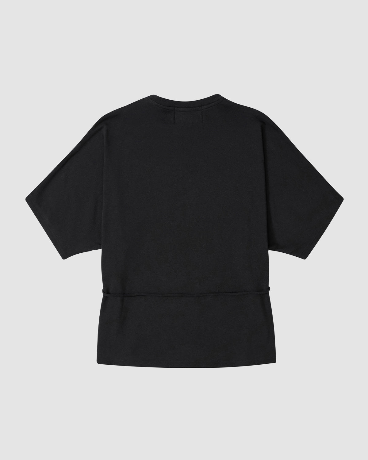 The BLACK BAERAE T-SHIRT by Sundae School is shown flat from the back on a light gray background, featuring a loose fit and horizontal lower back seam inspired by traditional Korean overcoat designs.