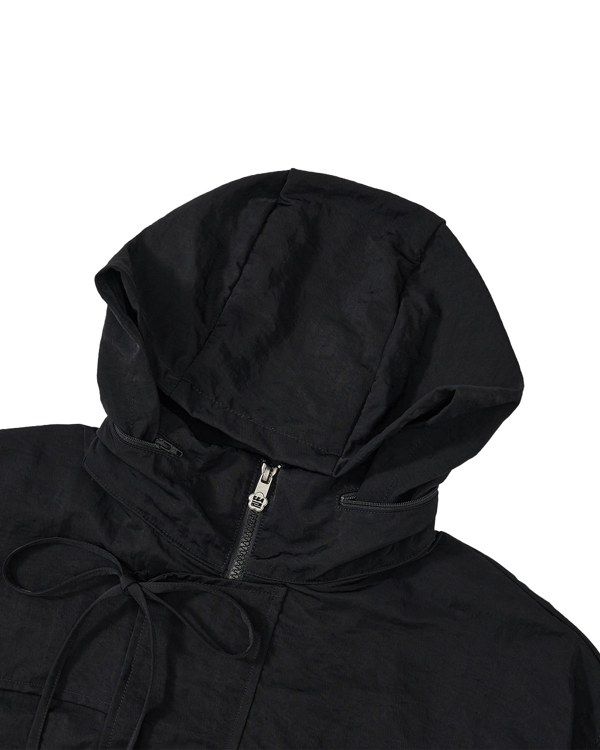 Close-up of a black hooded jacket with a front zipper and drawstring hood, shown against a plain white background.