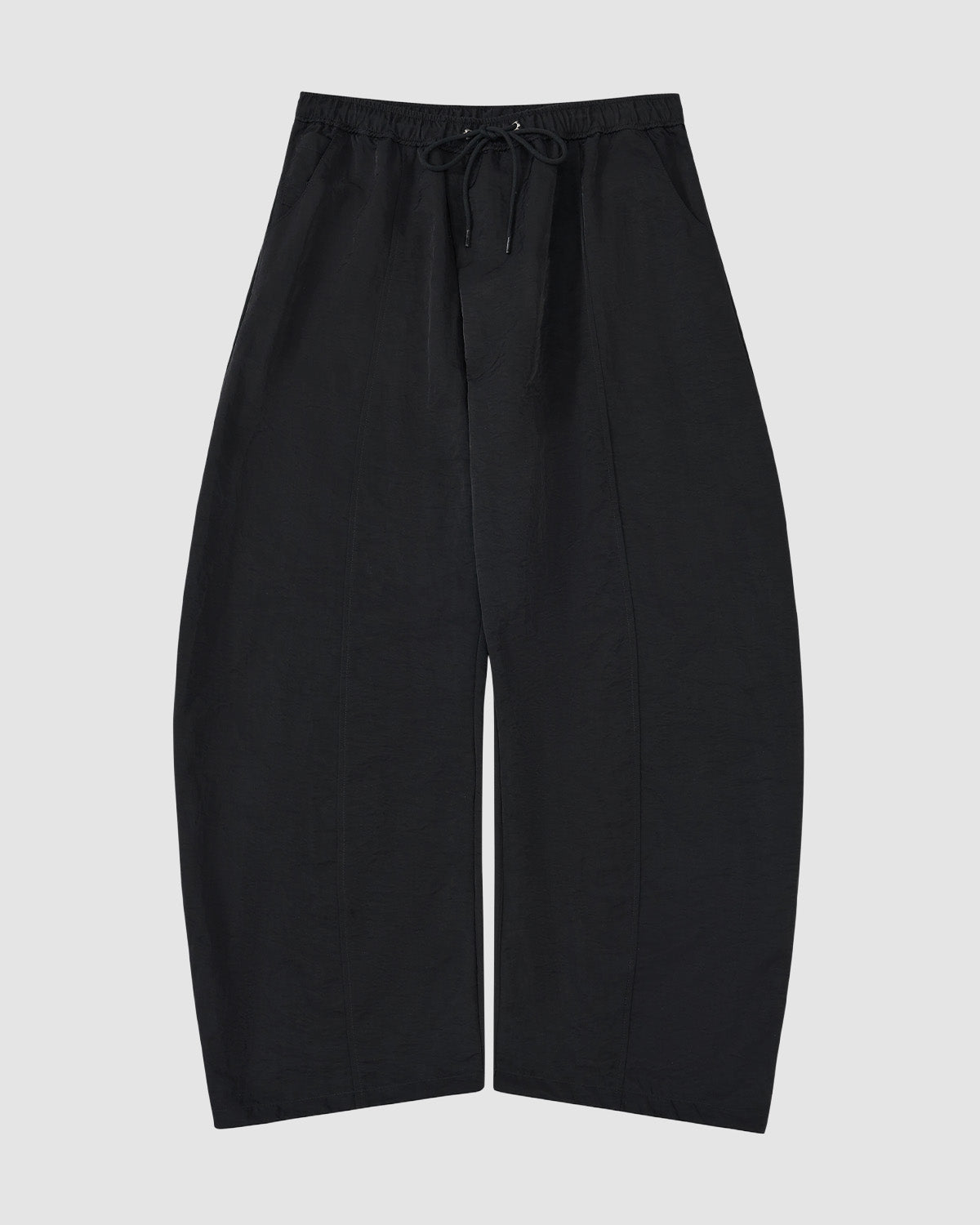 The BLACK HANBOK BALLOON TRACK PANTS by Sundae School feature a wide-leg fit, drawstring waist, vertical seams, and technical nylon fabric for windproof and water-resistant performance.