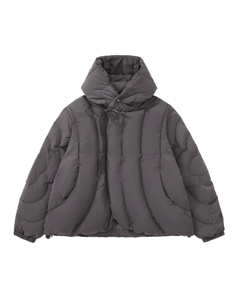 The CHARCOAL HEAVYWEIGHT MOCHI PUFFER by Sundae School—a gray puffer jacket with a hanbok-inspired silhouette, high padded collar, hood, and asymmetrical front closure—is displayed on a white background.