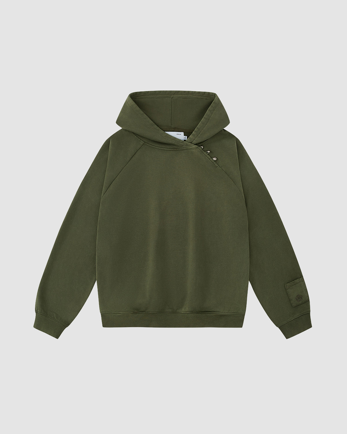 The Sundae School KHAKI HANBOK HOODIE features an olive green design with raglan sleeves, an asymmetrical button closure at the neckline, a patch on the left cuff, and a signature stash pocket, shown on a plain white background.