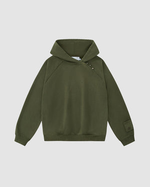 The Sundae School KHAKI HANBOK HOODIE features an olive green design with raglan sleeves, an asymmetrical button closure at the neckline, a patch on the left cuff, and a signature stash pocket, shown on a plain white background.