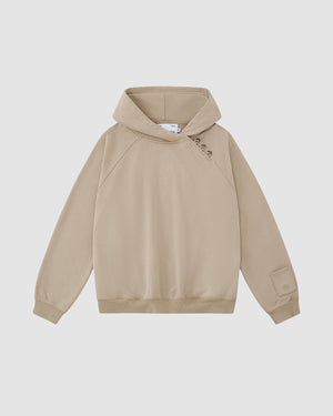 The Sundae School TAUPE HANBOK HOODIE features a custom "떨" logo, asymmetric hood closure with three right-shoulder buttons, and a signature sleeve stash pocket, shown against a plain white background.