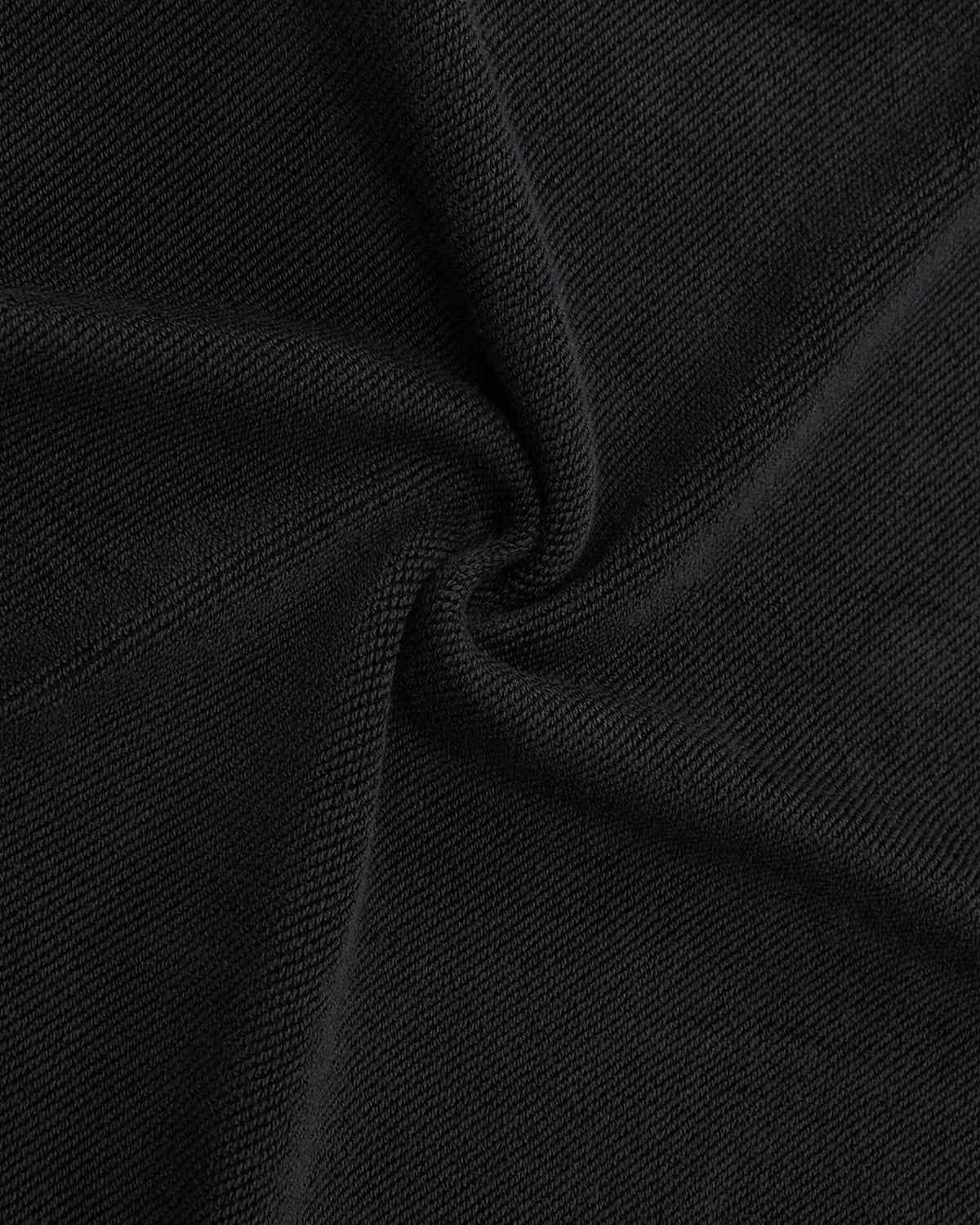 Close-up of black textured fabric with a swirling fold highlights fine knit details and a soft, matte finish—ideal for the Sundae School FADE BLACK HANBOK HOODIE.