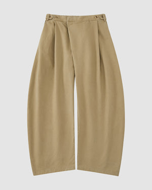 The OLIVE HANBOK CHINO PANTS by Sundae School feature a wide-leg, high-waisted barrel-fit chino silhouette with pleats and button details, inspired by classic hanbok styles, shown on a plain white background.