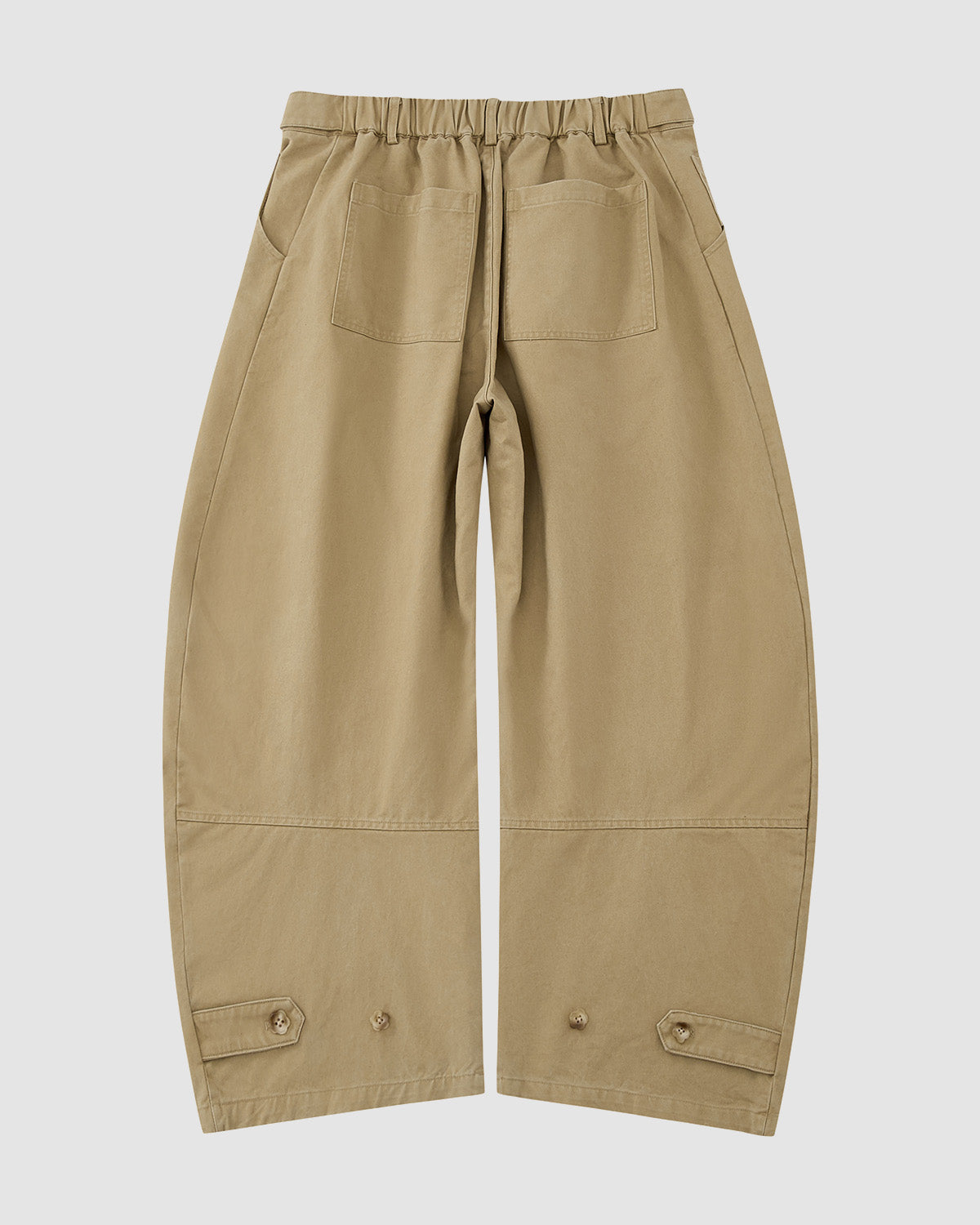 The Sundae School OLIVE HANBOK CHINO PANTS feature a wide-leg khaki design with an elastic waistband, two large back pockets, seam detailing, and adjustable buttoned hem tabs, shown flat on a white background.
