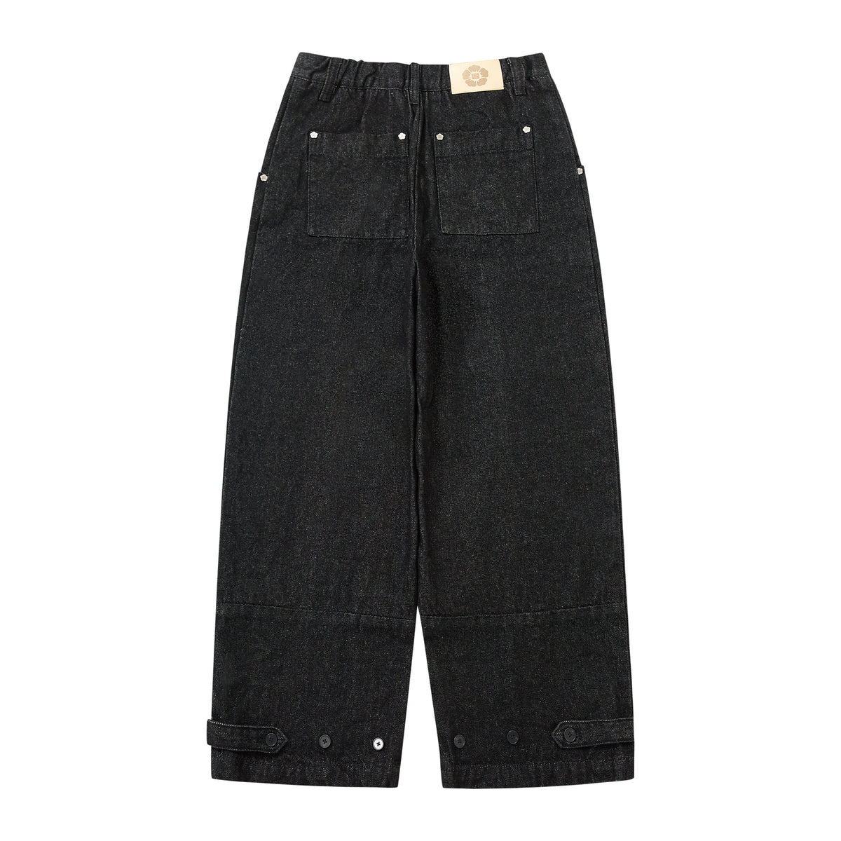 Black wide-leg denim pants with an elastic waistband, front patch pockets, and buttoned cuff tabs, shown flat on a white background.