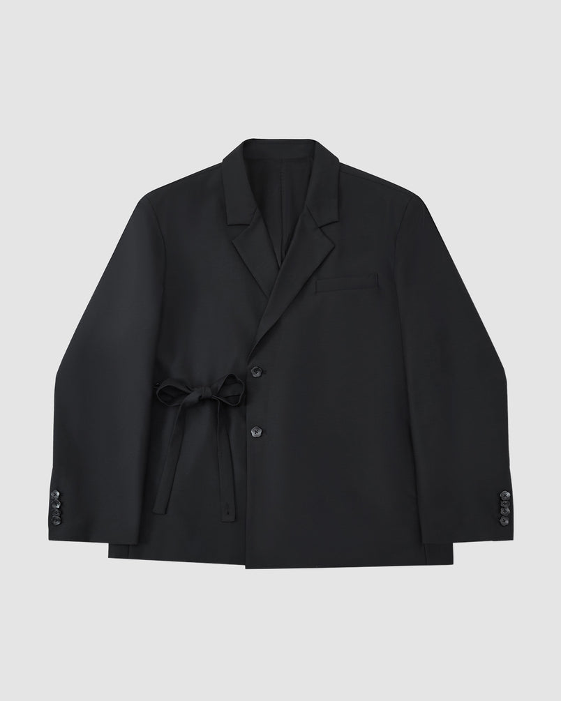 The BLACK DOUBLE DUTY BLAZER by Sundae School features a notched lapel, button closure, and hidden left-side goreum tie waist, shown laid flat on a light gray background.