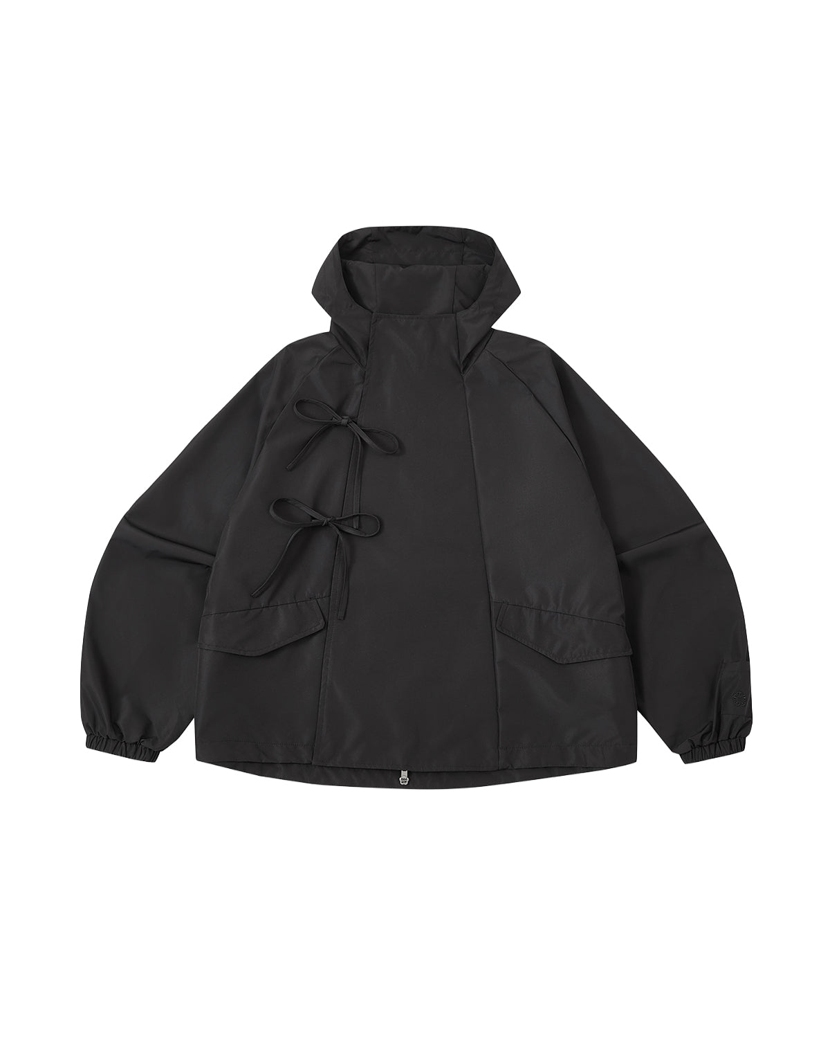 The BLACK JEOGORI TIE SHELL JACKET by Sundae School is a unisex, water-resistant outerwear piece inspired by the classic Korean jeogori. Featuring a black hood, high collar, two side pockets, and two signature bows on the left side, this technical jacket offers a loose fit with sleeves finished in elastic cuffs and includes a convenient zipper at the bottom for added functionality.